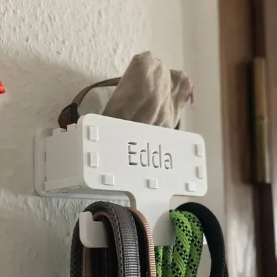 Cabide de parede para trelas