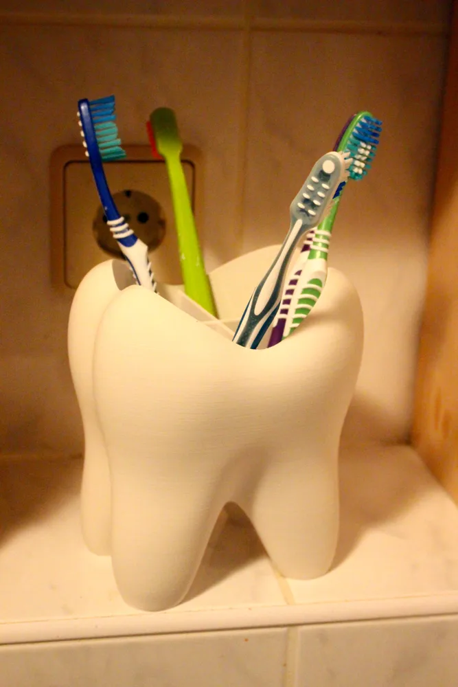 Porta-escovas em forma de dente